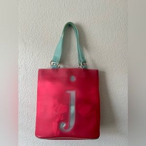 JAM by Jana Feiffer  pink jelly initial “j”  tote pink with blue straps.